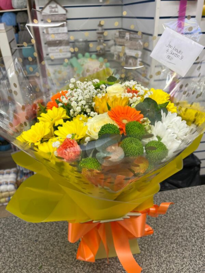 Colour Splash - A bright selection of orange yellow and white blooms makes this gift brighten up any room