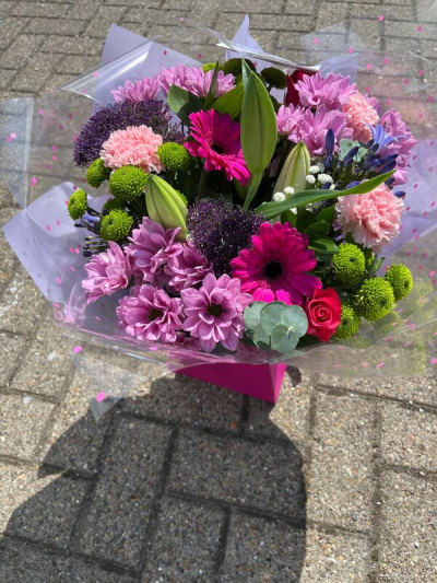 Pink Passion - A lovely selection of pink and lime flowers would brighten up any room and be the ideal gift